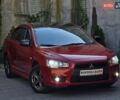 Червоний Міцубісі Lancer, об'ємом двигуна 2 л та пробігом 100 тис. км за 6999 $, фото 1 на Automoto.ua