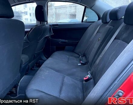 Червоний Міцубісі Lancer, об'ємом двигуна 2 л та пробігом 120 тис. км за 2999 $, фото 6 на Automoto.ua