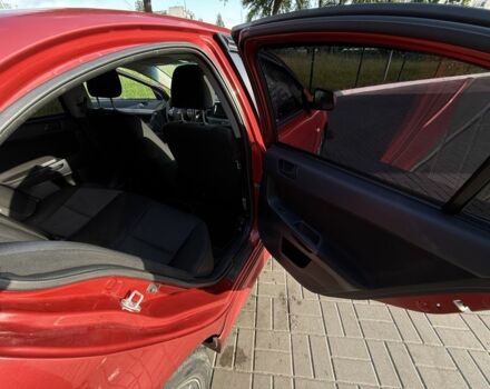 Красный Мицубиси Лансер, объемом двигателя 2 л и пробегом 215 тыс. км за 5999 $, фото 12 на Automoto.ua