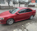 Червоний Міцубісі Lancer, об'ємом двигуна 2 л та пробігом 226 тис. км за 7500 $, фото 1 на Automoto.ua
