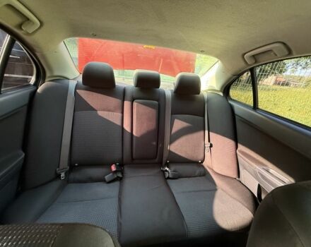 Красный Мицубиси Лансер, объемом двигателя 2 л и пробегом 215 тыс. км за 5999 $, фото 9 на Automoto.ua