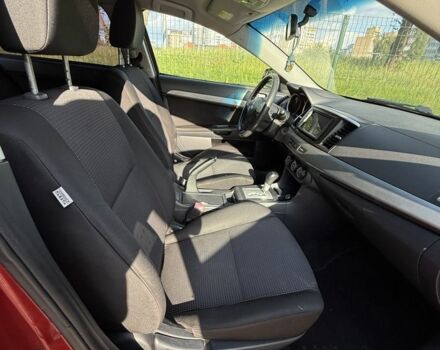 Красный Мицубиси Лансер, объемом двигателя 2 л и пробегом 215 тыс. км за 5999 $, фото 10 на Automoto.ua