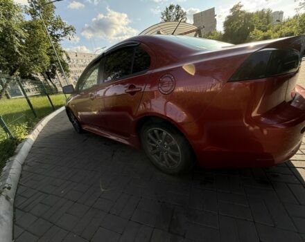 Красный Мицубиси Лансер, объемом двигателя 2 л и пробегом 215 тыс. км за 5999 $, фото 4 на Automoto.ua