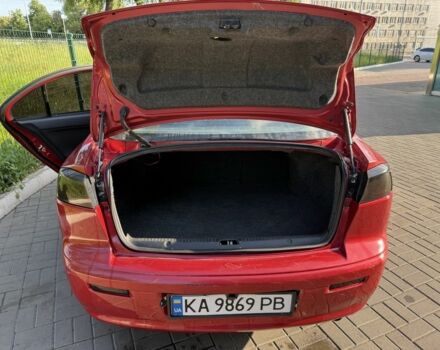 Красный Мицубиси Лансер, объемом двигателя 2 л и пробегом 215 тыс. км за 5999 $, фото 8 на Automoto.ua