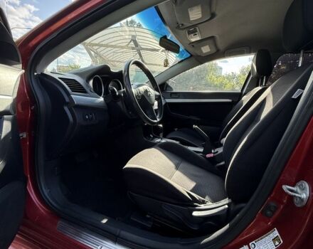 Красный Мицубиси Лансер, объемом двигателя 2 л и пробегом 215 тыс. км за 5999 $, фото 11 на Automoto.ua