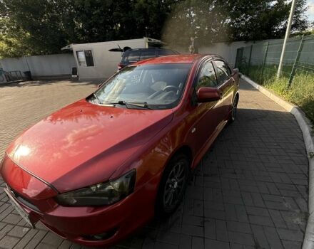 Красный Мицубиси Лансер, объемом двигателя 2 л и пробегом 215 тыс. км за 5999 $, фото 3 на Automoto.ua