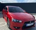 Червоний Міцубісі Lancer, об'ємом двигуна 2 л та пробігом 261 тис. км за 6300 $, фото 1 на Automoto.ua