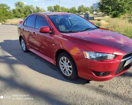 Червоний Міцубісі Lancer, об'ємом двигуна 2 л та пробігом 146 тис. км за 9000 $, фото 1 на Automoto.ua