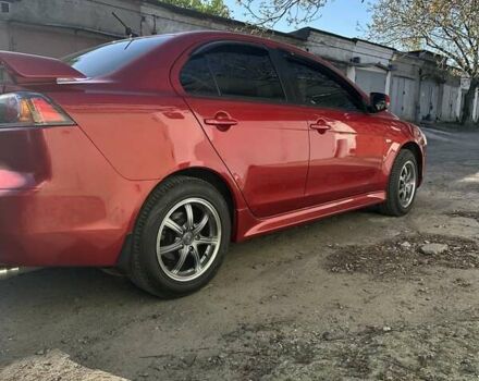 Червоний Міцубісі Lancer, об'ємом двигуна 2 л та пробігом 111 тис. км за 9700 $, фото 5 на Automoto.ua