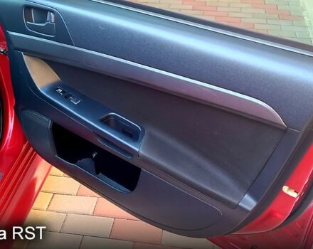 Красный Мицубиси Лансер, объемом двигателя 2 л и пробегом 254 тыс. км за 6300 $, фото 11 на Automoto.ua