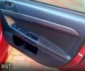 Красный Мицубиси Лансер, объемом двигателя 2 л и пробегом 254 тыс. км за 6300 $, фото 11 на Automoto.ua