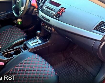 Красный Мицубиси Лансер, объемом двигателя 2 л и пробегом 254 тыс. км за 6300 $, фото 10 на Automoto.ua