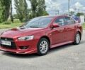 Червоний Міцубісі Lancer, об'ємом двигуна 2 л та пробігом 177 тис. км за 5999 $, фото 1 на Automoto.ua