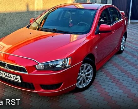 Красный Мицубиси Лансер, объемом двигателя 2 л и пробегом 254 тыс. км за 6300 $, фото 1 на Automoto.ua