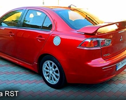 Красный Мицубиси Лансер, объемом двигателя 2 л и пробегом 254 тыс. км за 6300 $, фото 6 на Automoto.ua