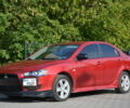 Червоний Міцубісі Lancer, об'ємом двигуна 2.4 л та пробігом 200 тис. км за 8900 $, фото 1 на Automoto.ua