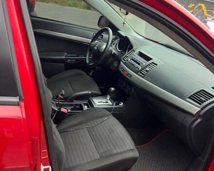 Красный Мицубиси Лансер, объемом двигателя 2 л и пробегом 230 тыс. км за 6700 $, фото 7 на Automoto.ua