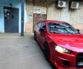 Красный Мицубиси Лансер, объемом двигателя 2 л и пробегом 160 тыс. км за 7500 $, фото 1 на Automoto.ua