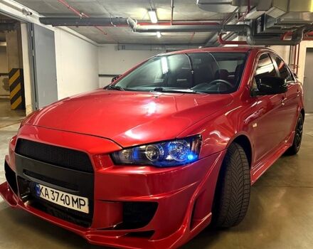 Красный Мицубиси Лансер, объемом двигателя 2 л и пробегом 260 тыс. км за 7300 $, фото 1 на Automoto.ua