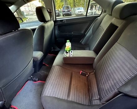 Мицубиси Лансер 2012 в Харькове на Automoto.ua Красный Мицубиси Лансер, объемом двигателя 2 л и пробегом 260 тыс. км за 6900 $, фото 4 на Automoto.ua