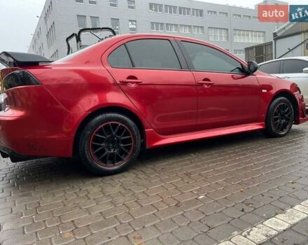 Красный Мицубиси Лансер, объемом двигателя 2 л и пробегом 230 тыс. км за 6700 $, фото 6 на Automoto.ua