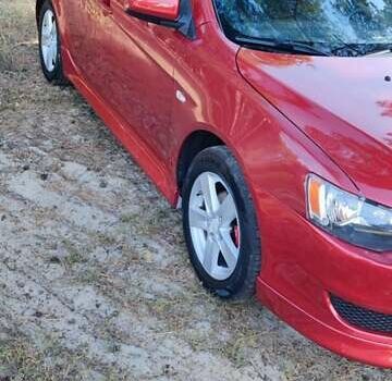 Красный Мицубиси Лансер, объемом двигателя 2 л и пробегом 180 тыс. км за 8100 $, фото 6 на Automoto.ua