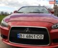 Червоний Міцубісі Lancer, об'ємом двигуна 2.36 л та пробігом 165 тис. км за 10000 $, фото 1 на Automoto.ua
