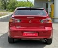 Красный Мицубиси Лансер, объемом двигателя 2.4 л и пробегом 179 тыс. км за 8499 $, фото 2 на Automoto.ua