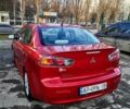 Червоний Міцубісі Lancer, об'ємом двигуна 2 л та пробігом 108 тис. км за 9400 $, фото 4 на Automoto.ua