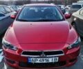 Червоний Міцубісі Lancer, об'ємом двигуна 2 л та пробігом 108 тис. км за 9400 $, фото 1 на Automoto.ua