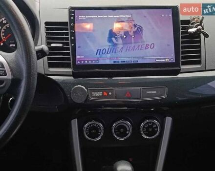 Червоний Міцубісі Lancer, об'ємом двигуна 2 л та пробігом 136 тис. км за 10990 $, фото 25 на Automoto.ua