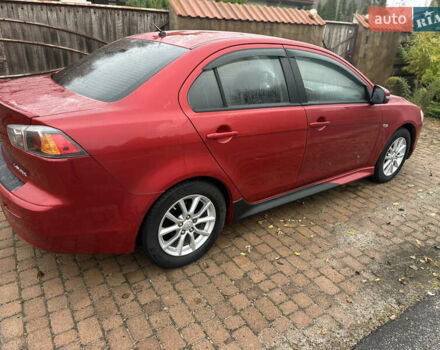Красный Мицубиси Лансер, объемом двигателя 2 л и пробегом 70 тыс. км за 7950 $, фото 1 на Automoto.ua