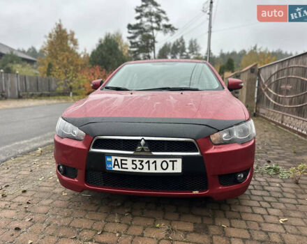 Красный Мицубиси Лансер, объемом двигателя 2 л и пробегом 70 тыс. км за 7950 $, фото 3 на Automoto.ua