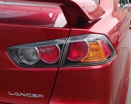 Красный Мицубиси Лансер, объемом двигателя 2 л и пробегом 136 тыс. км за 10990 $, фото 9 на Automoto.ua