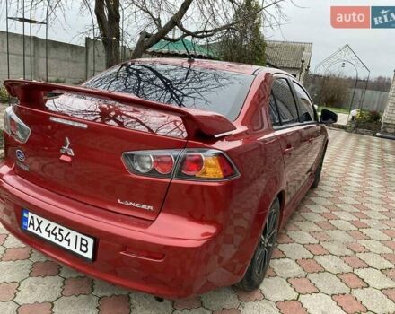 Красный Мицубиси Лансер, объемом двигателя 2 л и пробегом 134 тыс. км за 10500 $, фото 6 на Automoto.ua