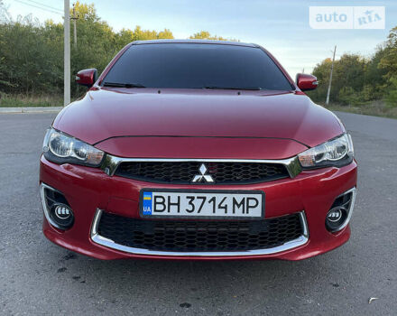 Червоний Міцубісі Lancer, об'ємом двигуна 2 л та пробігом 140 тис. км за 9900 $, фото 7 на Automoto.ua