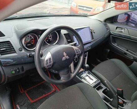 Червоний Міцубісі Lancer, об'ємом двигуна 2 л та пробігом 136 тис. км за 10990 $, фото 14 на Automoto.ua