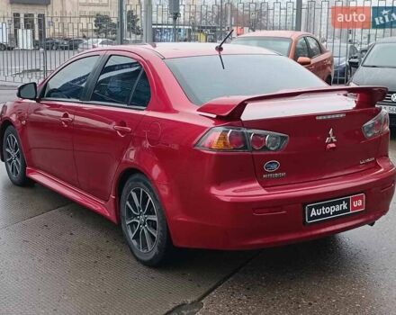 Червоний Міцубісі Lancer, об'ємом двигуна 2 л та пробігом 136 тис. км за 10990 $, фото 6 на Automoto.ua