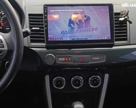 Красный Мицубиси Лансер, объемом двигателя 2 л и пробегом 136 тыс. км за 10990 $, фото 26 на Automoto.ua