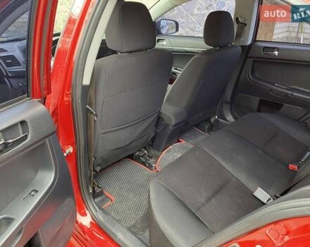 Красный Мицубиси Лансер, объемом двигателя 2 л и пробегом 134 тыс. км за 10500 $, фото 9 на Automoto.ua