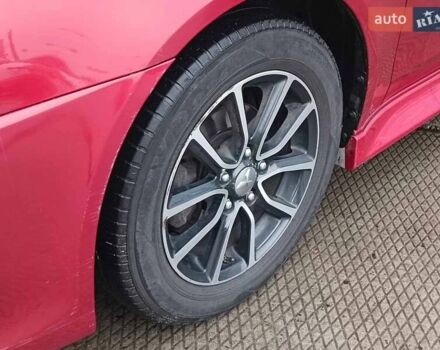 Червоний Міцубісі Lancer, об'ємом двигуна 2 л та пробігом 136 тис. км за 10990 $, фото 5 на Automoto.ua