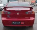 Червоний Міцубісі Lancer, об'ємом двигуна 2 л та пробігом 136 тис. км за 10990 $, фото 8 на Automoto.ua