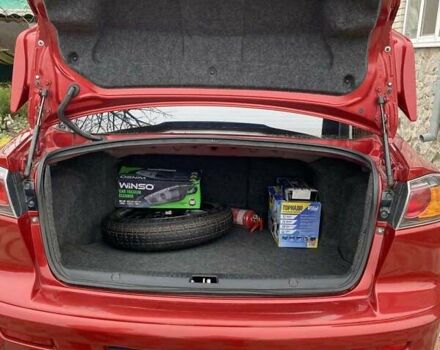 Красный Мицубиси Лансер, объемом двигателя 2 л и пробегом 134 тыс. км за 10500 $, фото 8 на Automoto.ua