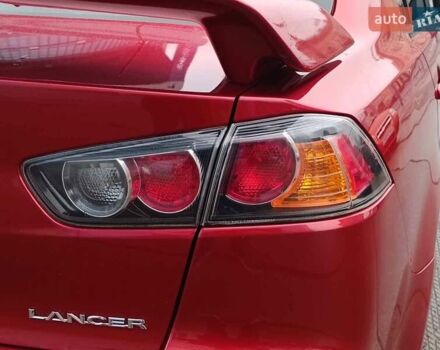 Червоний Міцубісі Lancer, об'ємом двигуна 2 л та пробігом 136 тис. км за 10990 $, фото 9 на Automoto.ua
