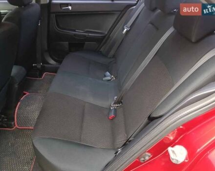 Червоний Міцубісі Lancer, об'ємом двигуна 2 л та пробігом 136 тис. км за 10990 $, фото 11 на Automoto.ua