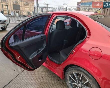 Червоний Міцубісі Lancer, об'ємом двигуна 2 л та пробігом 136 тис. км за 10990 $, фото 12 на Automoto.ua