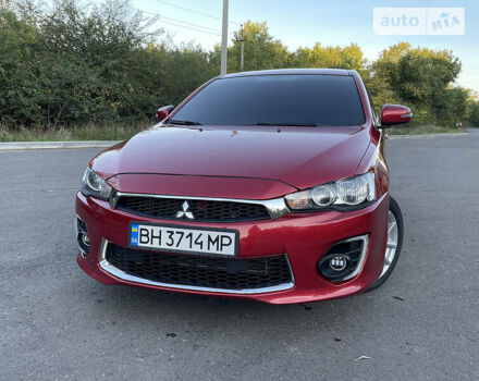 Червоний Міцубісі Lancer, об'ємом двигуна 2 л та пробігом 140 тис. км за 9900 $, фото 6 на Automoto.ua