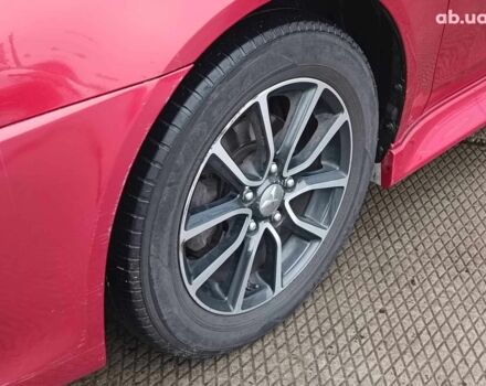 Красный Мицубиси Лансер, объемом двигателя 2 л и пробегом 136 тыс. км за 10990 $, фото 5 на Automoto.ua