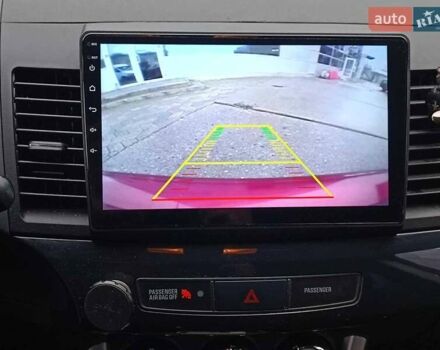 Червоний Міцубісі Lancer, об'ємом двигуна 2 л та пробігом 136 тис. км за 10990 $, фото 23 на Automoto.ua