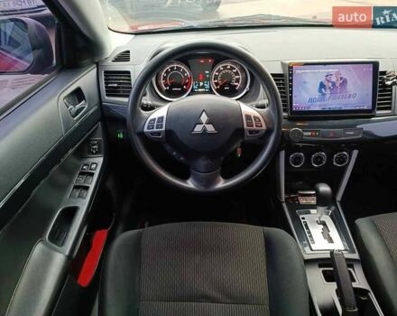 Червоний Міцубісі Lancer, об'ємом двигуна 2 л та пробігом 136 тис. км за 10990 $, фото 26 на Automoto.ua